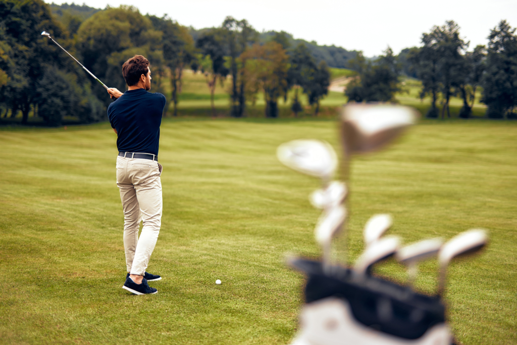 A,Dedicated,Golfer,Passionately,Swings,On,A,Beautifully,Lush,Green